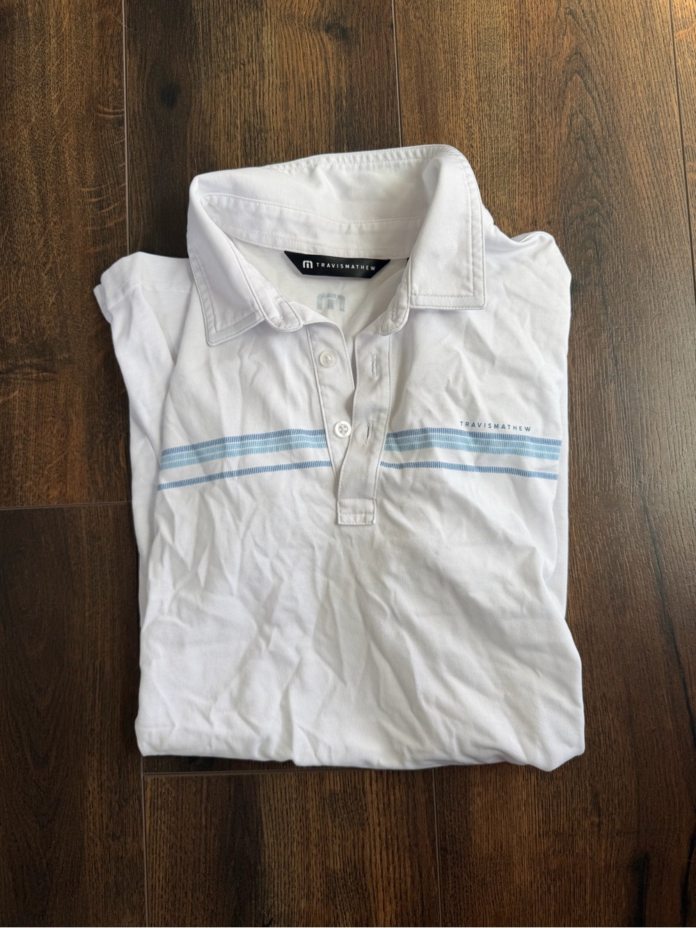 Travis Mathew White Polo with Pale Blue Chest Stripes